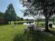 Community picnic area with tables and grill overlooking the pond at 4008 San Gallo Dr # 106, Kissimmee, FL 34741