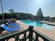 Inviting pool area featuring lounge chairs, umbrellas, and a spa for ultimate relaxation at 4008 San Gallo Dr # 106, Kissimmee, FL 34741