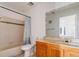 Clean bathroom featuring a vanity sink, marble countertop, and a shower-tub combination at 4017 Dijon Dr # 4017K, Orlando, FL 32808