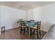 A dining area with wood flooring, white walls, and a modern dining table with four chairs at 4017 Dijon Dr # 4017K, Orlando, FL 32808