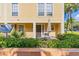 Charming exterior with patio and manicured green bushes at 4017 Dijon Dr # 4017K, Orlando, FL 32808
