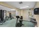 Well-equipped fitness center featuring exercise machines, weights, and natural light at 4017 Dijon Dr # 4017K, Orlando, FL 32808