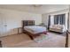 A spacious main bedroom features hardwood flooring, neutral walls, and a bright sitting area at 4017 Dijon Dr # 4017K, Orlando, FL 32808