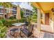 Private outdoor patio with seating area, brick pavers and lush landscaping at 4017 Dijon Dr # 4017K, Orlando, FL 32808