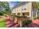 Community pool area with lounge chairs surrounded by lush landscaping at 4017 Dijon Dr # 4017K, Orlando, FL 32808