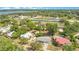 This aerial view showcases the neighborhood homes, and the community tennis courts at 416 E Seminole Ave, Lake Wales, FL 33853