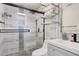 Modern bathroom with stylish glass shower, pebble floor, and sleek fixtures at 416 E Seminole Ave, Lake Wales, FL 33853