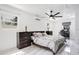 Bright bedroom features modern decor, a neutral color palette, and natural light from multiple windows at 416 E Seminole Ave, Lake Wales, FL 33853