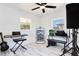 Bright bedroom with natural light, white walls, and a marble-look tiled floor perfect for hobbies at 416 E Seminole Ave, Lake Wales, FL 33853