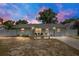 Charming single-story home featuring a well-manicured lawn, white fence, and inviting curb appeal at 416 E Seminole Ave, Lake Wales, FL 33853