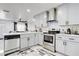 Modern kitchen featuring stainless steel appliances, sleek cabinetry, and stylish flooring at 416 E Seminole Ave, Lake Wales, FL 33853