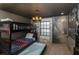 This bedroom features a bunk bed with pull-out trundle and a unique Harry Potter themed mural with a view into Hogwarts at 4875 Clock Tower Dr, Kissimmee, FL 34746