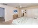 This bedroom offers neutral walls, a large closet, ceiling fan, and a double bed with colorful floral bedding at 4875 Clock Tower Dr, Kissimmee, FL 34746