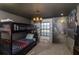 This bedroom features a bunk bed and a unique Harry Potter themed mural with a view into Hogwarts at 4875 Clock Tower Dr, Kissimmee, FL 34746