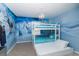 Charming bedroom featuring a unique 'Frozen' themed mural and a cozy bunk bed with pull-out trundle at 4875 Clock Tower Dr, Kissimmee, FL 34746