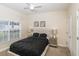 Comfortable bedroom with a window, ceiling fan, neutral walls, and cozy carpet flooring at 4875 Clock Tower Dr, Kissimmee, FL 34746