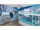 Themed bedroom with a bunk bed, mural, flat screen, and dresser at 4875 Clock Tower Dr, Kissimmee, FL 34746
