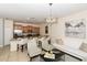 Open concept living room with stainless appliances, kitchen island, and modern furnishings at 4875 Clock Tower Dr, Kissimmee, FL 34746