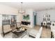 Inviting living space with comfortable seating, dining table, and sliding glass door to screened patio at 4875 Clock Tower Dr, Kissimmee, FL 34746