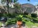 Outdoor space with lush green grass, landscaping, and a grill for entertaining at 4926 Reginald Rd, Orlando, FL 32829