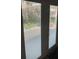 A view through glass doors offers a glimpse of the outdoor greenery, creating an airy and sunlit ambiance at 4926 Reginald Rd, Orlando, FL 32829