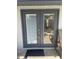 Elegant double doors provide access to outdoor space with blinds, offering privacy and natural light at 4926 Reginald Rd, Orlando, FL 32829