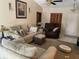 Inviting living room with sofa, recliner, and ottoman, accented by a ceiling fan and neutral decor, great for Gathering gatherings at 4926 Reginald Rd, Orlando, FL 32829