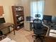 Functional home office with multiple desks, shelving, and ample workspace at 4926 Reginald Rd, Orlando, FL 32829