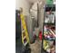 Utility area with hot water tank and assorted items on shelving at 4926 Reginald Rd, Orlando, FL 32829