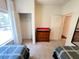 Bedroom featuring twin beds, dresser, closet, and door for easy access to other rooms at 5356 Diplomat Ct # 108, Kissimmee, FL 34746