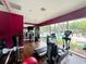Bright fitness center featuring modern exercise equipment and floor to ceiling windows overlooking the pool at 5356 Diplomat Ct # 108, Kissimmee, FL 34746