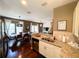 Well-equipped kitchen featuring a breakfast bar and seamless flow to the living area at 5356 Diplomat Ct # 108, Kissimmee, FL 34746