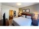 Comfortable bedroom featuring neutral tones and a glimpse into the ensuite bathroom at 5356 Diplomat Ct # 108, Kissimmee, FL 34746
