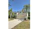 Charming two-story home with a well manicured lawn and beautiful landscaping at 5704 Ansley Way, Mount Dora, FL 32757