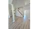Open concept living space with modern flooring, lots of light, and decorative columns at 5704 Ansley Way, Mount Dora, FL 32757