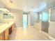 This main bathroom has double sinks, a shower, and a garden tub at 5704 Ansley Way, Mount Dora, FL 32757