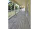 A very long porch overlooks the serene yard in this spacious home at 5704 Ansley Way, Mount Dora, FL 32757