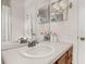Bathroom with a large mirror reflecting double vanity with a sink at 6214 Stevenson Dr # 106, Orlando, FL 32835