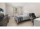 Bedroom with natural light, a gray dresser, tile floors, and a desk area at 6214 Stevenson Dr # 106, Orlando, FL 32835