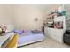 Bedroom with a desk, white dresser, tile flooring, and natural light at 6214 Stevenson Dr # 106, Orlando, FL 32835