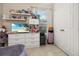 Bedroom featuring a desk, white dresser, window and neutral walls at 6214 Stevenson Dr # 106, Orlando, FL 32835