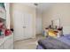 Bedroom featuring neutral walls, tile floors and a double door closet at 6214 Stevenson Dr # 106, Orlando, FL 32835