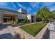 Charming clubhouse exterior featuring lush landscaping and inviting outdoor seating area at 6214 Stevenson Dr # 106, Orlando, FL 32835