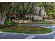 Stonebridge Place entrance sign surrounded by colorful flowers and lush landscaping at 6214 Stevenson Dr # 106, Orlando, FL 32835
