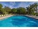 Inviting community pool with lounge chairs, perfect for relaxing and soaking up the sun at 6214 Stevenson Dr # 106, Orlando, FL 32835