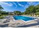 Beautiful community pool area with comfortable lounge chairs and refreshing, clear water at 6214 Stevenson Dr # 106, Orlando, FL 32835