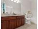 Bathroom featuring a double vanity, tile flooring, and a combination tub and shower at 7144 Five Oaks Dr, Harmony, FL 34773