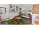 Playful bedroom with whimsical decor, a picnic table, and carpet at 7144 Five Oaks Dr, Harmony, FL 34773