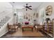 Cozy living room features natural light, neutral walls, and comfortable seating arrangements at 7144 Five Oaks Dr, Harmony, FL 34773