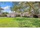 Charming single story home with an expansive lawn and mature trees providing plenty of shade at 7222 Stanford Dr, Lakeland, FL 33809